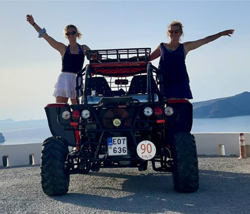 Group enjoying ATV quad tour through Santorini villages